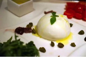 ITALIAN BURRATA SERVED WITH BABY TOMATO, ANCHOVY AND RUCOLA